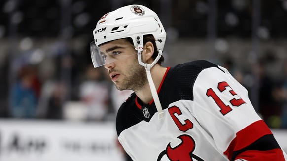New Jersey Devils center Nico Hischier (13) skates during warmups before an NHL hockey game against the San Jose Sharks on Monday, Jan. 16, 2023, in San Jose, Calif. (AP Photo/Josie Lepe)