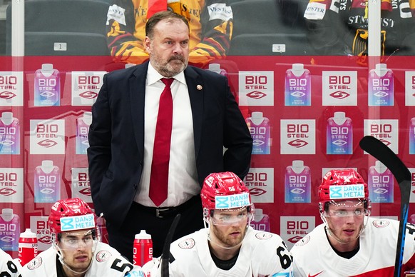 Denmark's head coach Heinz Ehlers watches the group A match between Denmark and Germany at the ice hockey world championship in Tampere, Finland, Thursday, May 18, 2023. (AP Photo/Pavel Golovkin)